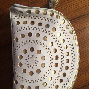 NWOT leather like cosmetic bag with gold tassel